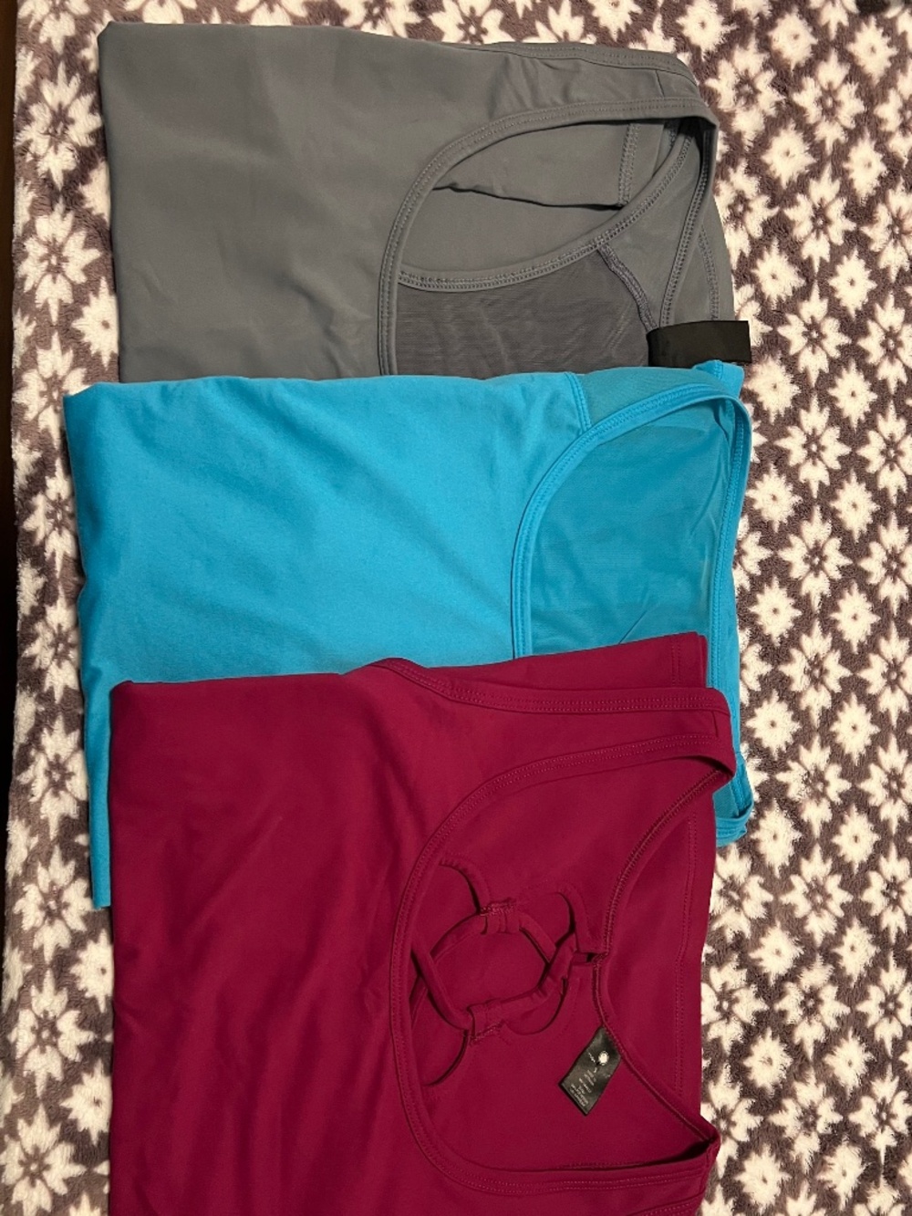Bundle of sleeveless activewear shirts